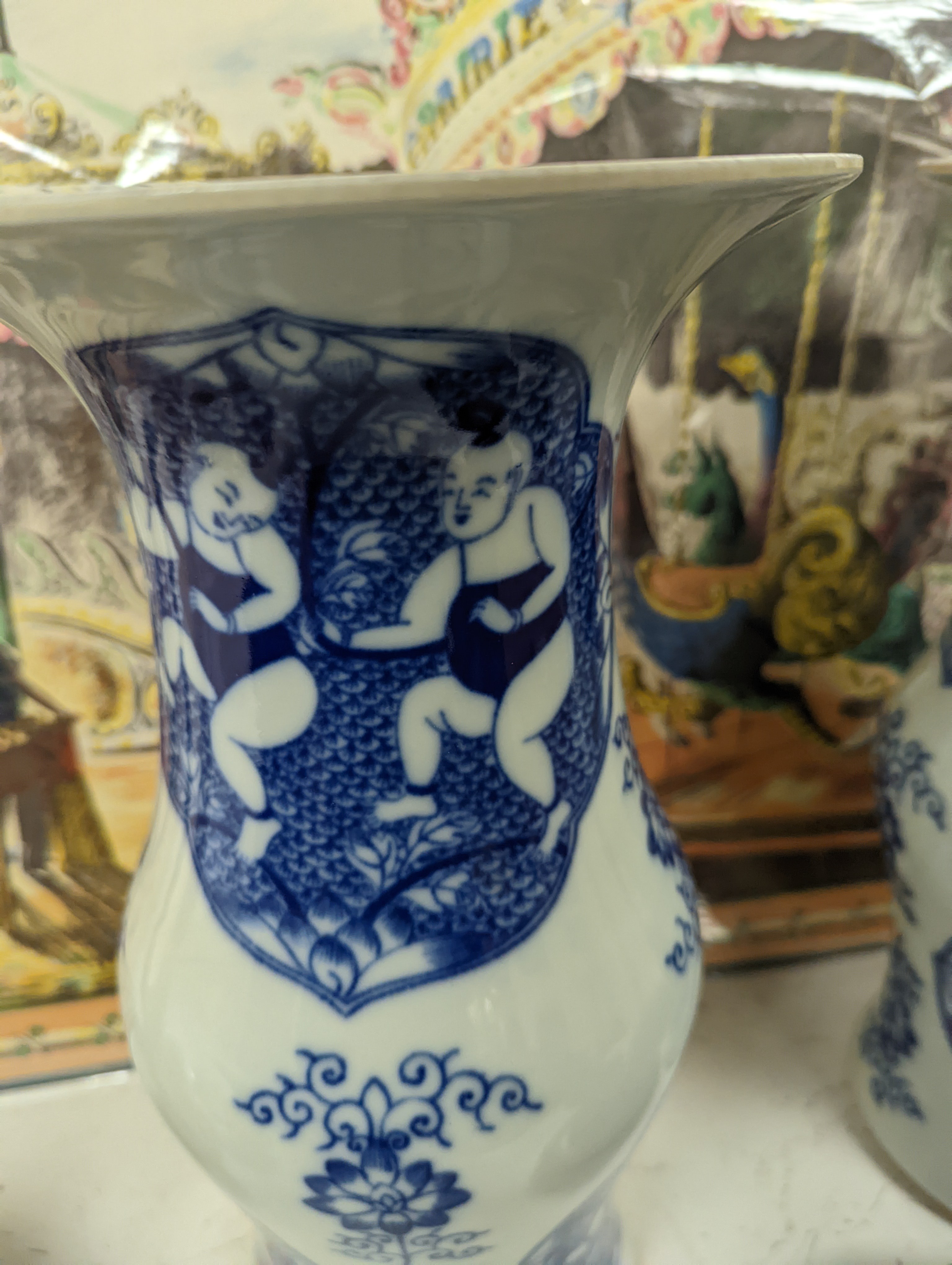 A pair of Chinese blue and white vases on stands and 6 further wood stands. Vases 35cm
